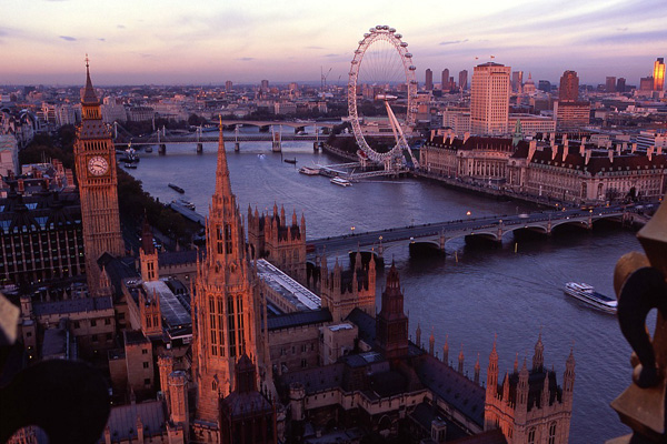 View from the top of the Victoria Tower, the lesser known of the two towers of the Houses of Parliament, towards Big Ben, the River Thames and the London Eye